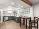 Finished basement kitchen featuring updated cabinetry, stainless steel appliances, and stylish design at 2695 S Logan St, Denver, CO 80210
