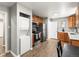 Kitchen features stainless steel appliances, ample cabinet space and an in-unit washer/dryer at 2695 S Logan St, Denver, CO 80210