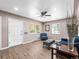 Bright living room with light wood floors, neutral walls, and ample natural light at 2695 S Logan St, Denver, CO 80210