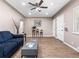 Spacious living room with stylish decor, light wood floors, and a cozy atmosphere at 2695 S Logan St, Denver, CO 80210