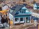 Aerial view of a charming house and surrounding neighborhood at 319 13Th Ave, Idaho Springs, CO 80452