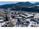 Aerial view of the property and the surrounding mountain neighborhood at 319 13Th Ave, Idaho Springs, CO 80452