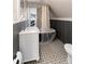 Bathroom with clawfoot tub, patterned floor tile and a view to the mountain at 319 13Th Ave, Idaho Springs, CO 80452