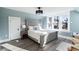 Main bedroom with gray bed frame and large windows at 319 13Th Ave, Idaho Springs, CO 80452