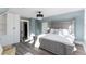 Main bedroom with gray bed frame and built-in white wardrobe at 319 13Th Ave, Idaho Springs, CO 80452