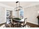 Charming dining room with whitewashed brick walls and a rustic table at 319 13Th Ave, Idaho Springs, CO 80452