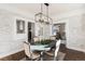 Elegant dining room with whitewashed brick and a farmhouse table at 319 13Th Ave, Idaho Springs, CO 80452