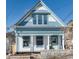 Charming two-story home with light blue accents and a stone facade at 319 13Th Ave, Idaho Springs, CO 80452