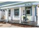 Charming home exterior with white siding, light-blue trim, and a welcoming front porch at 319 13Th Ave, Idaho Springs, CO 80452