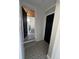 Bright hallway with patterned tile floors and access to bedrooms at 319 13Th Ave, Idaho Springs, CO 80452