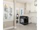 Modern kitchen with white cabinets, patterned floors, and stainless steel appliances at 319 13Th Ave, Idaho Springs, CO 80452