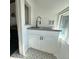 Small, well-appointed kitchenette with sink, cooktop, and white cabinetry at 319 13Th Ave, Idaho Springs, CO 80452