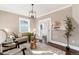 Light and airy living room with hardwood floors, neutral decor and stained glass windows at 319 13Th Ave, Idaho Springs, CO 80452