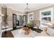 Cozy living room with hardwood floors, a neutral color scheme and stained glass windows at 319 13Th Ave, Idaho Springs, CO 80452