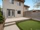 Large backyard with patio, turf area, and a modern fence, offering a great outdoor space at 3841 Stuart St, Denver, CO 80212