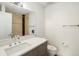 Contemporary bathroom featuring a vanity, toilet, and tiled walk-in shower at 3841 Stuart St, Denver, CO 80212