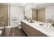 Modern bathroom with double vanity, walk-in shower, and sleek design at 3841 Stuart St, Denver, CO 80212