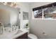 Stylish bathroom features a modern sink, and a window that allows natural light at 3841 Stuart St, Denver, CO 80212