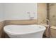 Soaking tub with modern fixtures and a luxurious, spa-like feel at 3841 Stuart St, Denver, CO 80212