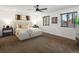 Comfortable bedroom showcasing plush carpet, natural light, and a cozy atmosphere at 3841 Stuart St, Denver, CO 80212