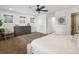 Bright bedroom featuring a ceiling fan, natural light, and a spacious walk-in closet at 3841 Stuart St, Denver, CO 80212