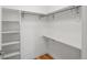 Walk-in closet with built-in shelving and wooden floors at 3841 Stuart St, Denver, CO 80212