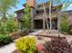 Contemporary home boasting stone accents, a landscaped yard, and a private balcony at 3841 Stuart St, Denver, CO 80212