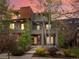 Contemporary home boasting stone accents, a landscaped yard, and a private balcony at 3841 Stuart St, Denver, CO 80212