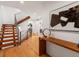Inviting foyer showcasing hardwood floors, a modern staircase, and stylish decor at 3841 Stuart St, Denver, CO 80212