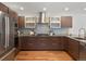 Contemporary kitchen featuring modern cabinets, stainless steel appliances, and stylish finishes at 3841 Stuart St, Denver, CO 80212
