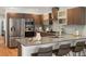 Modern kitchen with stainless steel appliances, breakfast bar and sleek countertops at 3841 Stuart St, Denver, CO 80212