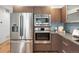 Modern kitchen features stainless steel appliances and sleek cabinetry, creating a stylish space at 3841 Stuart St, Denver, CO 80212