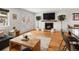 Comfortable living room with modern fireplace, hardwood floors, and access to a backyard patio at 3841 Stuart St, Denver, CO 80212