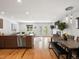 Open concept living and dining area with hardwood floors and ample natural light at 3841 Stuart St, Denver, CO 80212