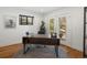 Inviting home office with a modern desk, lots of natural light, and view of exterior landscape at 3841 Stuart St, Denver, CO 80212