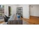 Bright office space with hardwood floors, a modern desk, and access to an outdoor patio at 3841 Stuart St, Denver, CO 80212