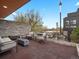 Outdoor patio with comfortable seating, a stone wall, and city views at 3841 Stuart St, Denver, CO 80212