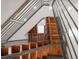 Unique open staircase with wood treads and metal railing leading to the upper level at 3841 Stuart St, Denver, CO 80212