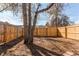 Large backyard enclosed by a wooden fence, offering privacy and space for outdoor activities and landscaping at 1969 Uinta St, Denver, CO 80220