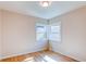 Bright bedroom with hardwood floors, corner windows, and ample natural light at 1969 Uinta St, Denver, CO 80220