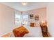 Cozy bedroom with hardwood floors, natural light, and neutral decor, creating a relaxing atmosphere at 1969 Uinta St, Denver, CO 80220