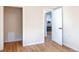 Hallway features hardwood floors and open doorway to the updated kitchen area at 1969 Uinta St, Denver, CO 80220