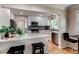 Modern kitchen with white cabinetry, stainless steel appliances, and stylish backsplash at 1969 Uinta St, Denver, CO 80220