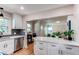 Remodeled kitchen with a breakfast bar open to a lovely living space at 1969 Uinta St, Denver, CO 80220