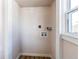 Dedicated laundry room with modern hookups, convenient connections, and a bright window at 1969 Uinta St, Denver, CO 80220