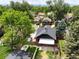 Aerial view of a home showcasing its backyard, neighborhood, and city views in the distance at 2636 N Glencoe St, Denver, CO 80207