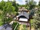 Aerial view of a home showcasing its backyard, neighborhood, and city views in the distance at 2636 N Glencoe St, Denver, CO 80207