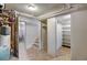 Unfinished basement with storage room, stairs and access to the utility room at 2636 N Glencoe St, Denver, CO 80207