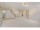 Spacious basement with stairs and neutral carpeting at 2636 N Glencoe St, Denver, CO 80207