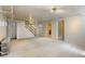 Open basement area featuring a staircase, radiator, and neutral colored carpet at 2636 N Glencoe St, Denver, CO 80207